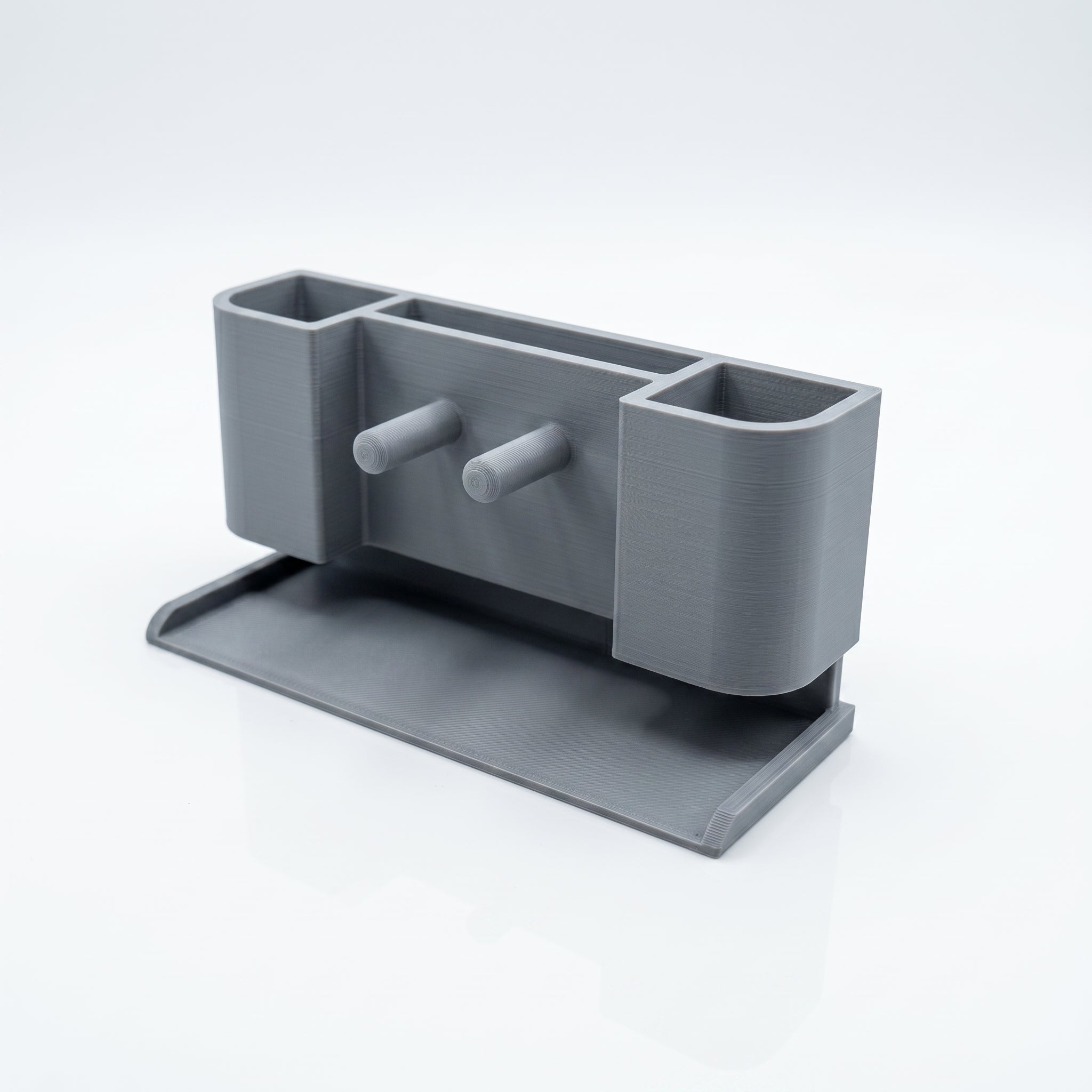 Gray desk organizer with multiple compartments on a white background