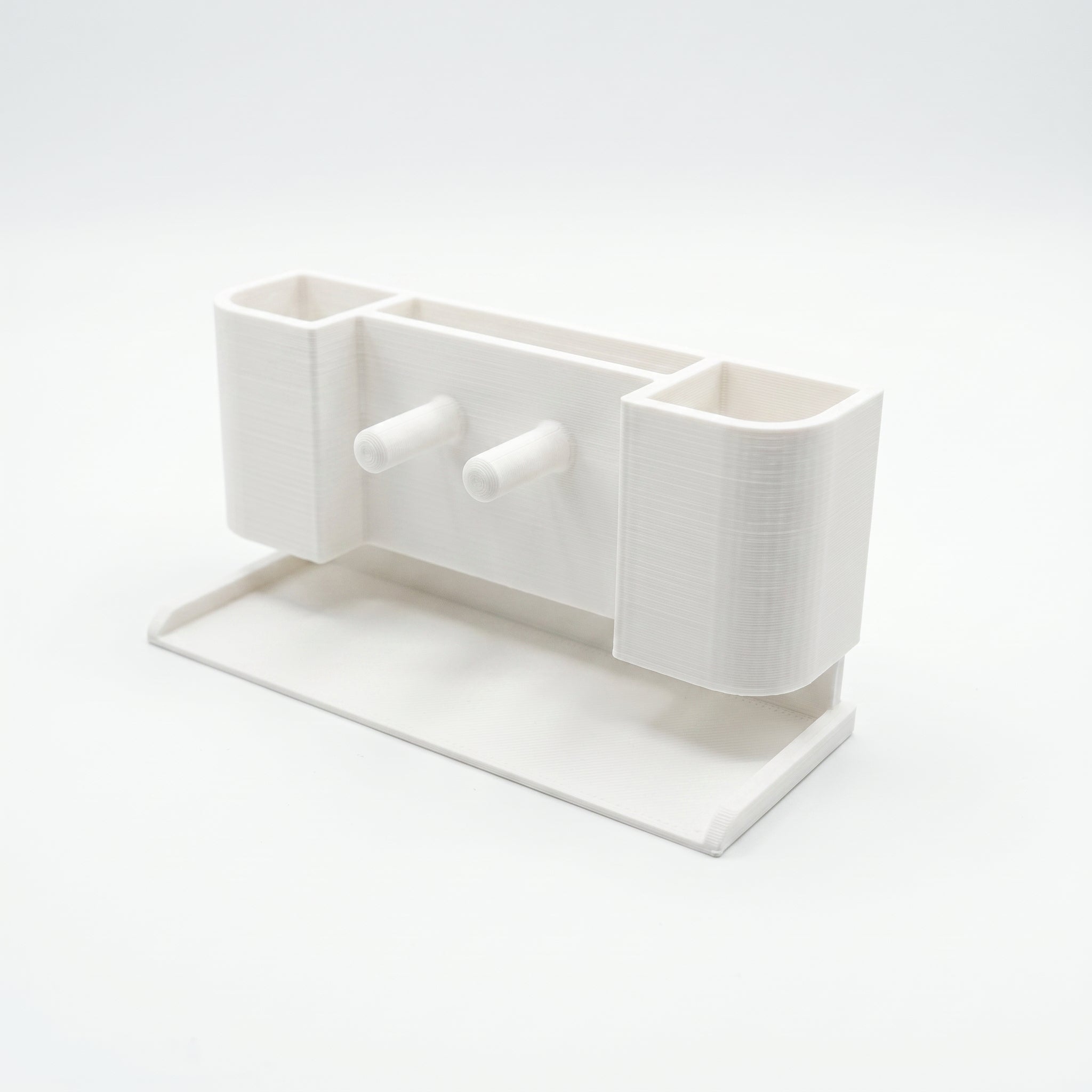 White ceramic planter with a rectangular base on a white background