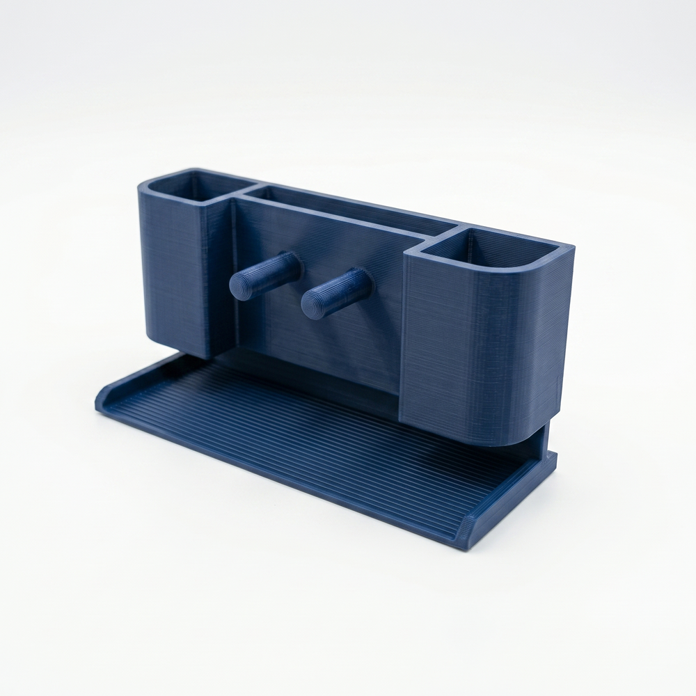 Blue desk organizer with compartments on a white background